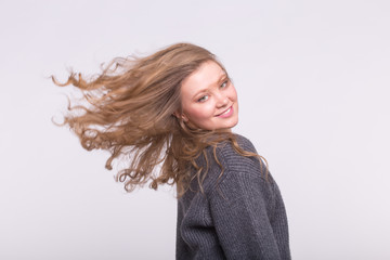 Portrait of beautiful young woman with curly wave hair