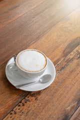 hot coffee in white cup and saucer