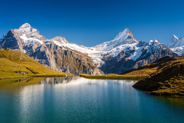 Obraz premium Encountering Bachalpsee during the famous hiking trail from First to Grindelwald (Bernese Alps, Switzerland). You can have great views on mountains like the Eiger, Monch and Jungfrau.