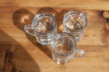 soda spritzer drink refreshment. Three Glass cup of white wine on wooden table in Vineyards in Heuriger tavern in Eastern Austria, where a local winemaker serves his new wine. Top view