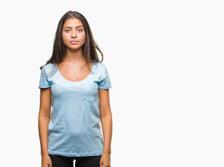 Obraz premium Young beautiful arab woman over isolated background with serious expression on face. Simple and natural looking at the camera.