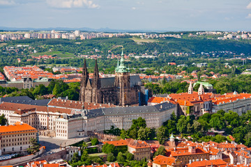 Fototapeta na wymiar Aerial view of the city. St. Vitus Cathedral over old town red roofs. Prague, Czech Republic