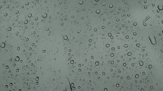 Raining on Glass Window. Sound of Rain included