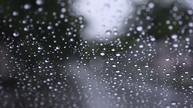 Raining on Glass Window, Roadside as background, Sound of Rain and Thunder included