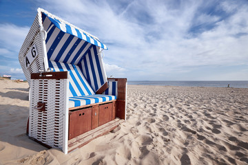 roofed wicker beach chair on baltic sea beach - obrazy, fototapety, plakaty