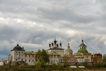 Fototapeta na wymiar Holy Trinity Belopesotsky Convent in the cloudy autumn afternoon in a distance