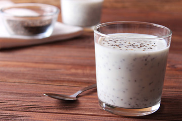chia pudding with yogurt on a wooden background. A simple recipe for proper nutrition, useful supplements, super food