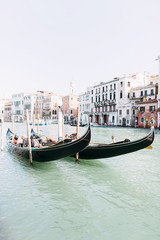 Beautiful view of the canal in Venice. Canal with Gondolas and boats, old buildings