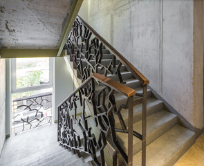 Staircase, staircase in a modern house. Iron decorative railings. © Aleks Kend