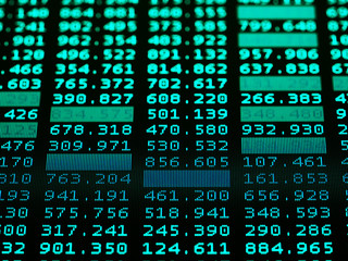 Fototapeta premium Concept of Financial data on a monitor. Display of Stock market quotes on black background.