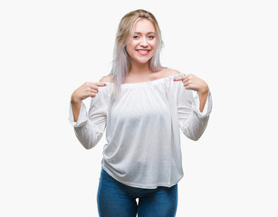 Fototapeta na wymiar Young blonde woman over isolated background looking confident with smile on face, pointing oneself with fingers proud and happy.