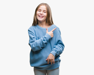 Young beautiful girl wearing winter sweater over isolated background cheerful with a smile of face pointing with hand and finger up to the side with happy and natural expression on face