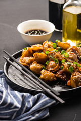 Fried dumplings with soy sauce with pepper and green onions. Asian cuisine
