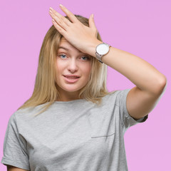 Young caucasian woman over isolated background surprised with hand on head for mistake, remember...