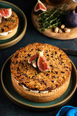 Tarte on sand base with fresh figs, almonds and crispy waffle with almonds and cocoa powder. Fresh Homemade Fruit Tart with berries
