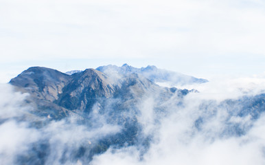Fototapeta na wymiar The mountain peak in the cloud.