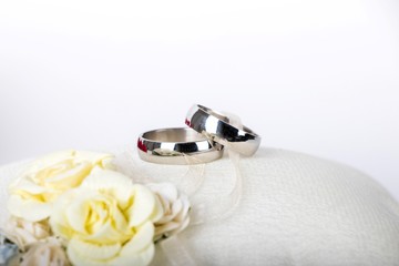 silver wedding rings - wedding rings on a silk pillow