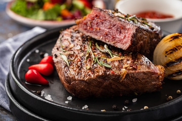 Steak beef. Beef steak medium with red pepper, aromatic herbs and fried onion