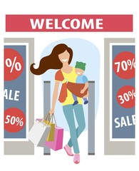 young mom smiles and leaves the store with the baby