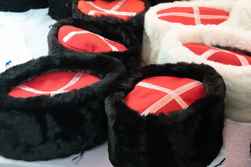 Cossack caps on the counter. Traditional Cossack clothes.