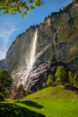 Sun shining on the Staubbach fall (Berner Oberland, Switzerland) in the Lauterbrunnen Valley in september. It is one of the deepest valleys in the Alpine chain. 