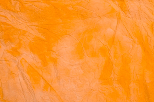 orange creased colored tissue paper background texture © aga7ta