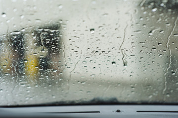 Water drops on car window close up