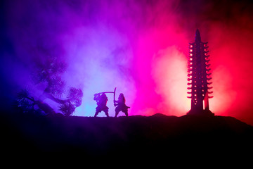 Samurai fighting concept. Silhouette of samurais in duel near tree and old temple. Picture with two...