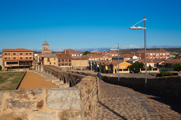 CAMINO DE SANTIAGO, SPAIN - AUGUST 8, 2018 - Some pilgrims walking along the way of St.James, in Hospital de Orbigo