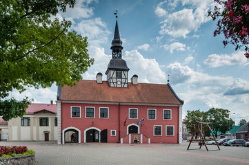 View to the Bauska town hall in historical center with cloudy sky. Bauska, Latvia. Front view.