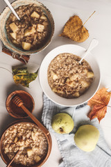 Healthy breakfast flat lay. Apple oatmeal with cinnamon and honey.