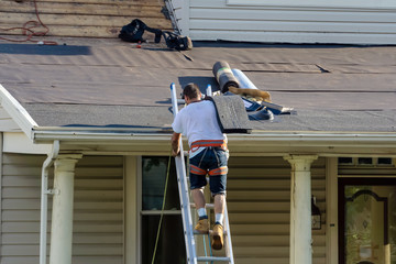 roofers are changing roof shingles