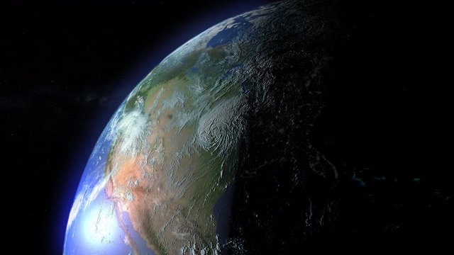 A slow zoom into Earth's orbit. Day/night terminator passes over the United States in the northern hemisphere.  	