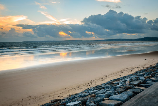 Storm clouds at sunset on Aberavon beach, Wales, UK