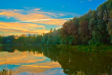 Fototapeta na wymiar Lake and forest at dusk in autumn. Kostroma, Russia.