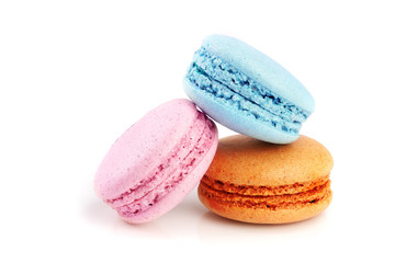 orange and chocolate macaroon isolated on white background closeup