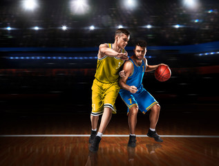 two basketball players in scrimmage during basketball match