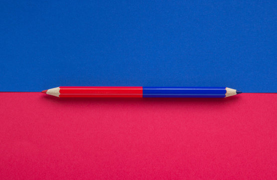 Close-up of a red blue pencil on a background, concept of education