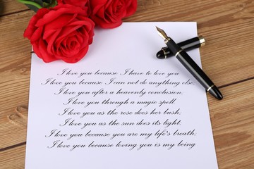 
love letter - handwritten letter with a declaration of love with red roses on a wooden table - valentines day - marriage proposal - i love you