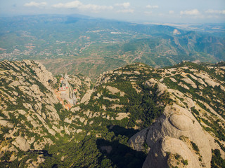 Montserrat, Catalonia, Spain. Top View Of Hillside Cave Santa Cova De Montserrat Or Holy Cave Of...