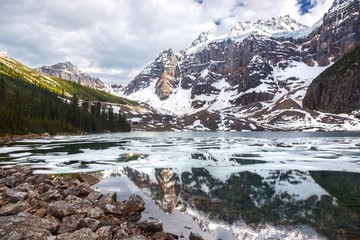 Fototapeta na wymiar Mount Quadra Snowy Mountain Peak reflected in upper Consolation Lake, Banff National Park, Rocky Mountains, Alberta, Canada