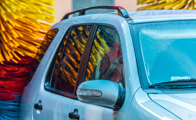 Car going through an automated car wash machine