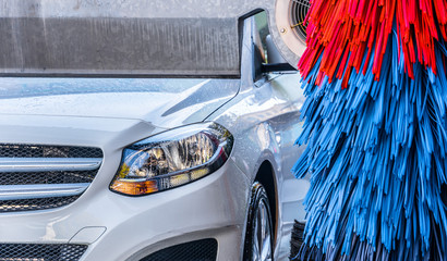 Car going through an automated car wash machine