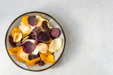 Bowl of Healthy Snack from Vegetable Chips, such as Sweet Potato