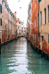 Fototapeta na wymiar Colourful and relaxing canal in Venice