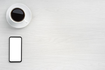 Coffee cup and smartphone
