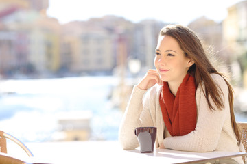 Woman relaxing in a coffee shop on vacation