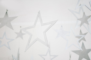 Merry Christmas and happy New year. Stylish holiday decor. Background for cards. Silver stars