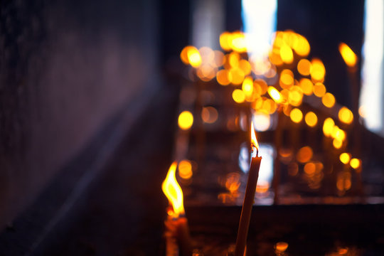 burning candles inside the monastery