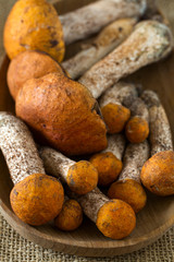 orange-cap boletus on wooden surface